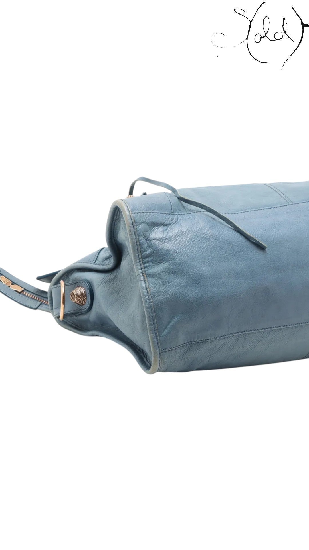 Sold Attire light blue lambskin Balenciaga Part Time bag with rose gold hardware and zipper detail.
