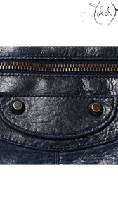 Sold Attire navy blue lambskin Balenciaga Classic Hardware Work bag with aged brass zipper and studs.
