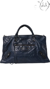 Sold Attire navy blue lambskin Balenciaga Classic Hardware Work bag with aged brass hardware and tassel zipper pulls.
