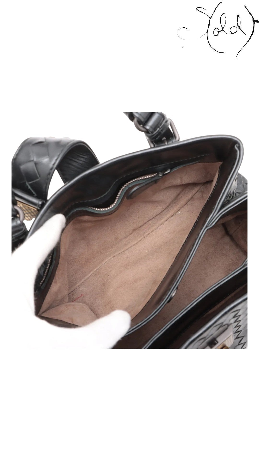 Sold Attire black Bottega Veneta Roma Intrecciato nappa leather handbag interior with suede lining and zip pocket.