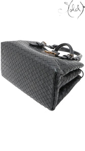 Sold Attire black Bottega Veneta Roma Intrecciato nappa leather 2-way handbag with brushed silver hardware and lock detail.