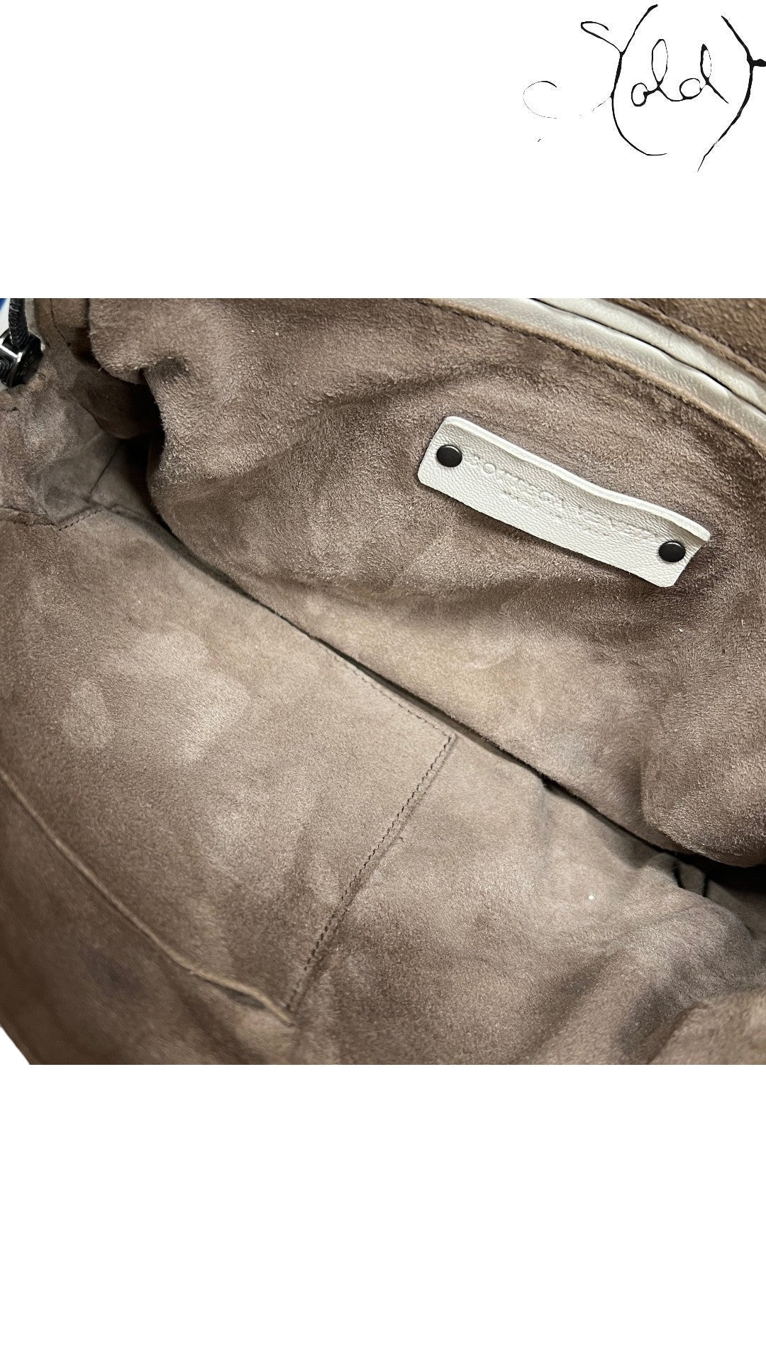 Sold Attire Bottega Veneta taupe nappa leather Nodini crossbody bag interior with suede lining and brand tag.