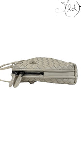 Sold Attire taupe nappa leather Bottega Veneta Nodini crossbody bag with signature Intrecciato weave and dark gunmetal zipper.