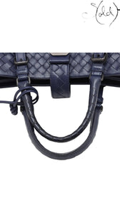 Sold Attire navy blue calfskin Bottega Veneta Roma small intrecciato 2-way bag with braided handles and gold-tone hardware.