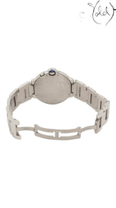 Sold Attire Cartier Ballon Bleu W6920011 stainless steel watch with blue cabochon crown and GMT function.