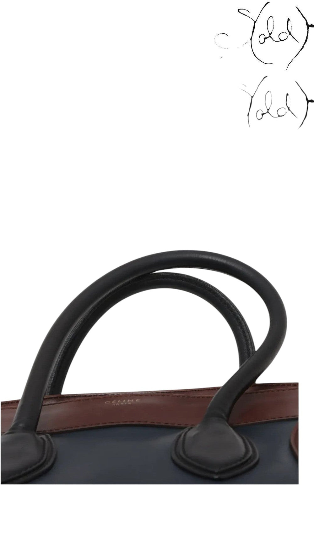 Sold Attire pre-owned Celine Luggage Mini Shopper in navy and brown leather with rolled handles and gold logo stamp