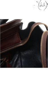 Sold Attire pre-owned Celine Luggage Mini Shopper featuring navy and brown leather with metallic zip hardware detail.