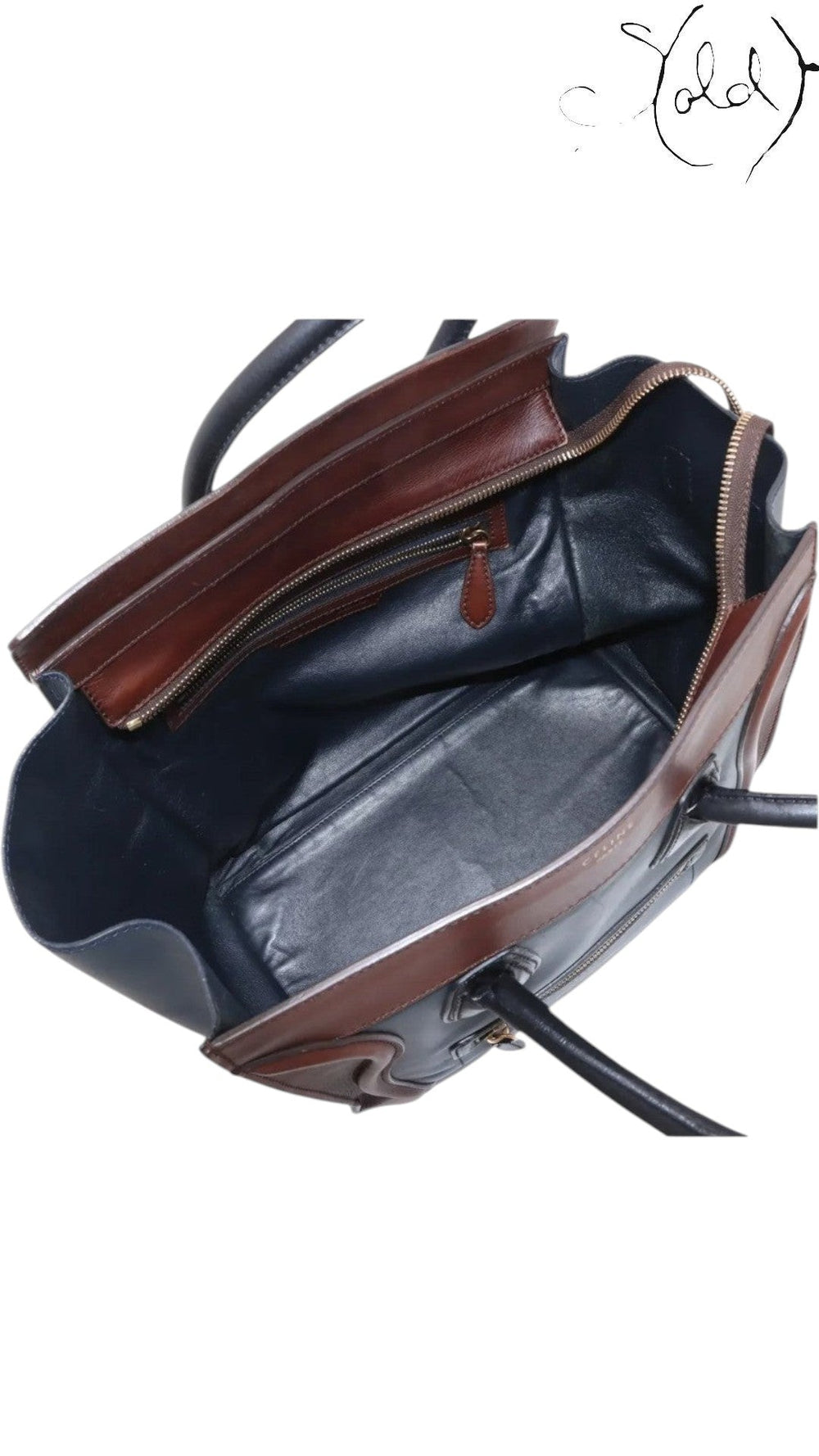 Sold Attire pre-owned Celine Luggage Mini Shopper in navy and brown leather with top zip and structured winged sides.