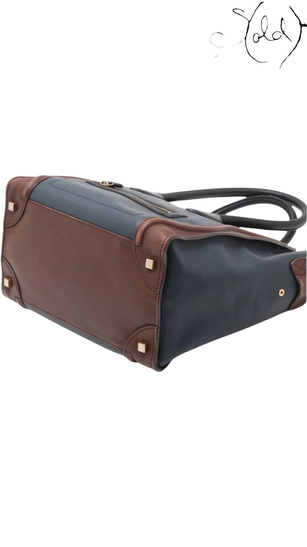 Sold Attire pre-owned Celine Luggage Mini Shopper in navy and brown leather with protective base studs