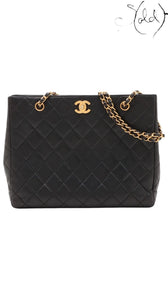 Sold Attire black quilted lambskin Chanel CC Turn-Lock Chain Tote with gold hardware and chain straps.