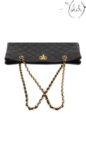 Sold Attire black quilted lambskin Chanel CC Turn-Lock chain tote with gold hardware.