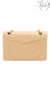 Sold Attire beige lambskin Chanel Matelasse 23 Double Flap bag with gold hardware and diamond quilting. Features a back slip pocket and chain strap.