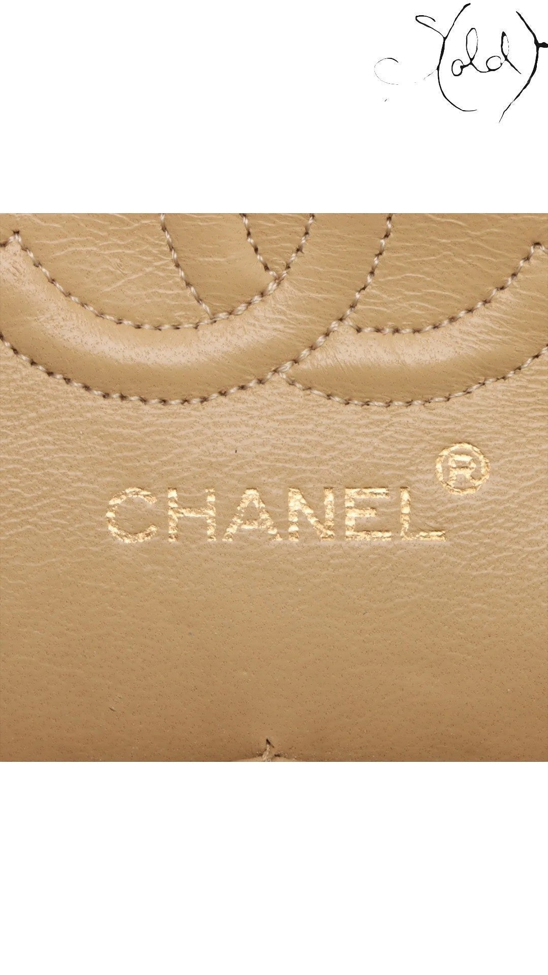 Sold Attire beige lambskin Chanel Matelasse 23 Double Flap bag detail showing quilted pattern and gold embossed logo.