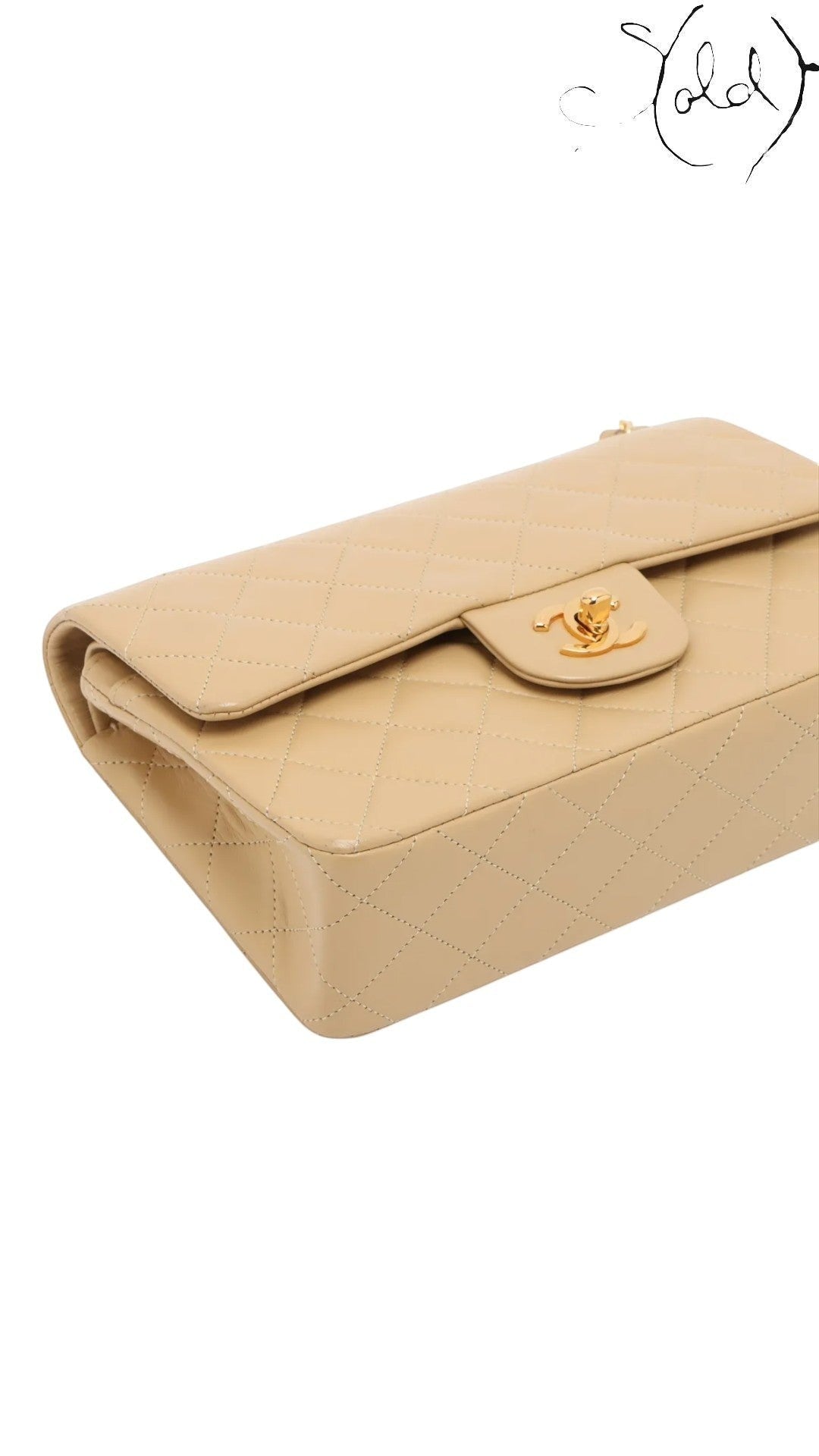 Sold Attire beige lambskin Chanel Matelasse 23 double flap bag with gold CC turn-lock closure and matelassé quilting.