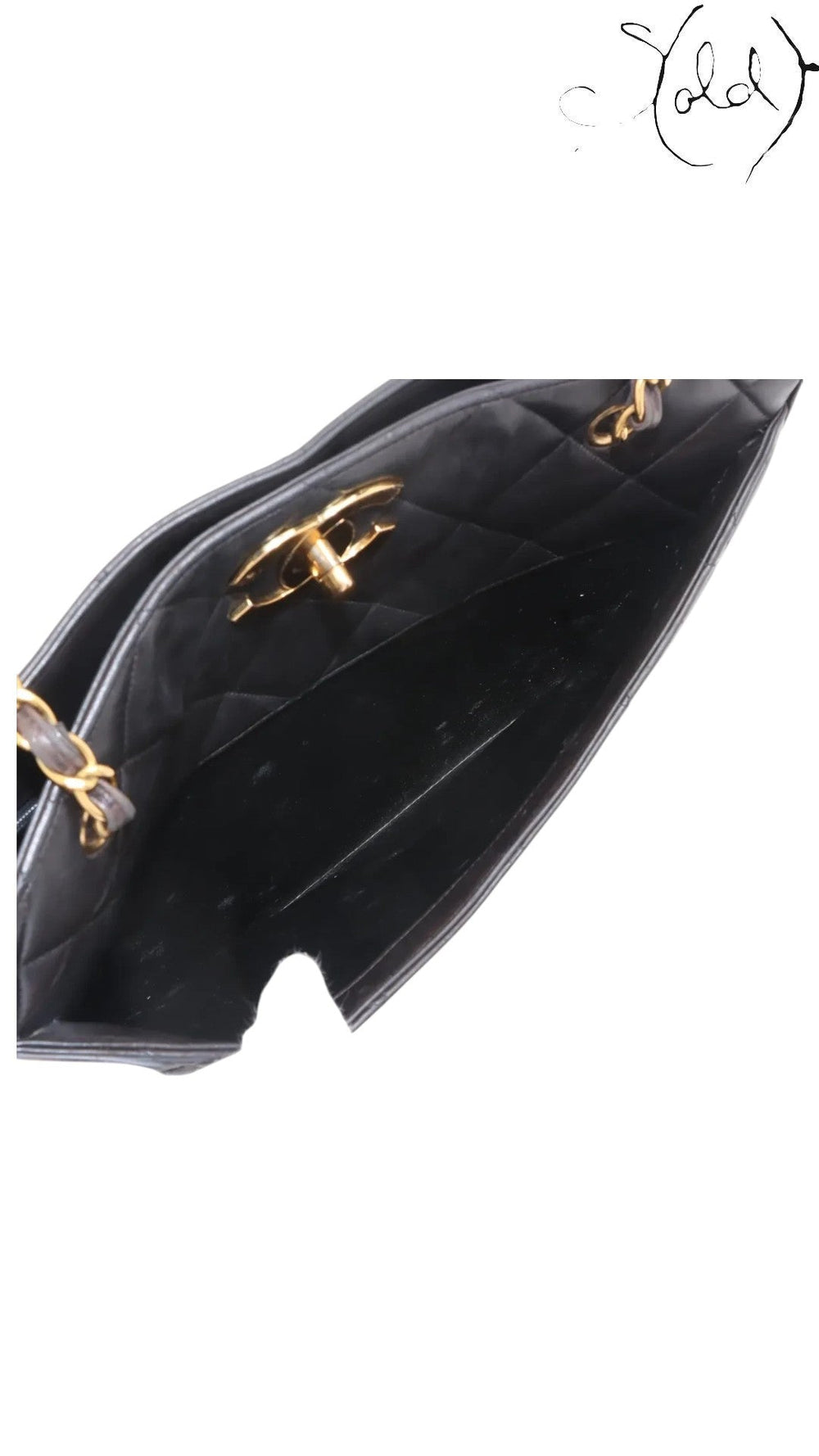 Sold Attire black quilted lambskin matelasse chain tote with gold hardware and interior pocket.