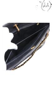 Sold Attire black quilted lambskin matelasse chain tote with gold hardware and interior pockets.