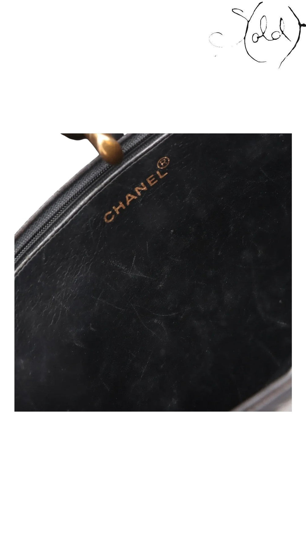 Sold Attire black lambskin matelasse chain tote interior showing gold Chanel logo and zipper detail.