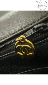 Sold Attire chocolate brown quilted lambskin Chanel Classique Single Full Flap bag with gold CC charm and zipper detail.