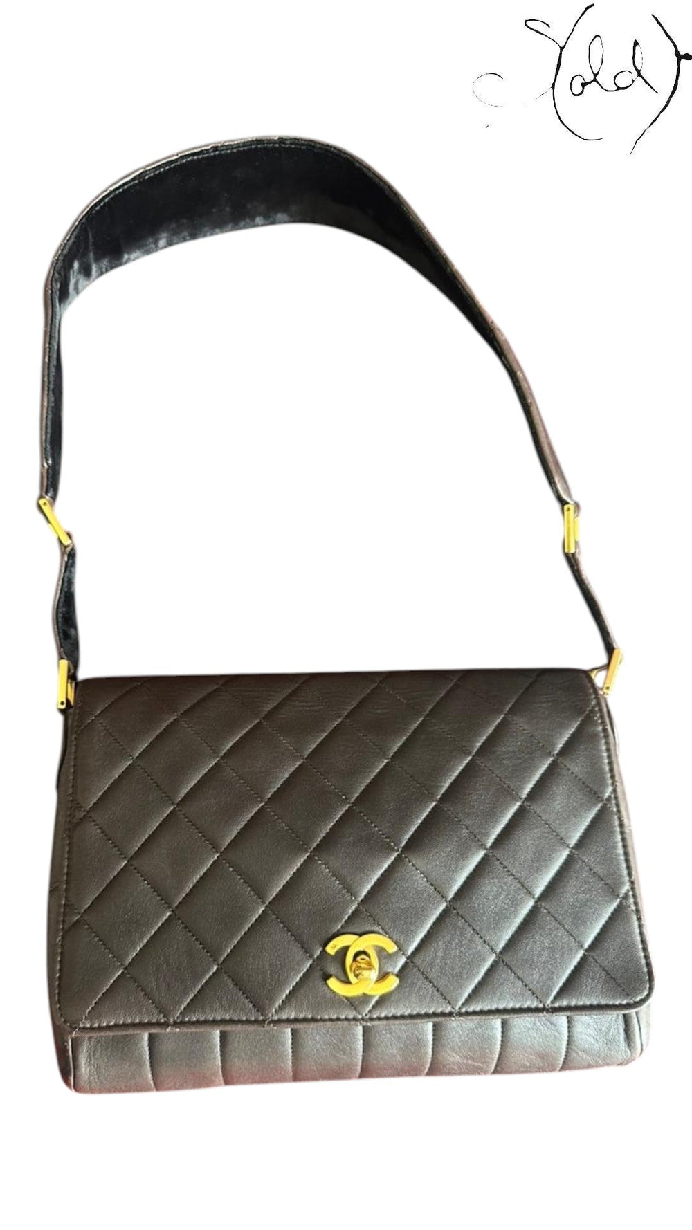 Sold Attire chocolate brown quilted lambskin Chanel Classique Single Full Flap bag with 24k gold CC turn-lock and suede strap.