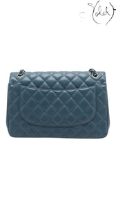 Sold Attire blue lambskin Chanel Deca Matelasse 30 Large Double Flap bag with silver hardware and quilted diamond pattern.