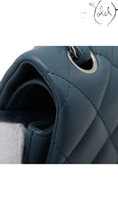 Sold Attire blue lambskin Chanel Deca Matelasse 30 Large Double Flap bag with silver hardware and diamond quilting.