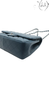 Sold Attire blue lambskin Chanel Deca Matelasse 30 double flap bag with silver-tone hardware and chain strap.