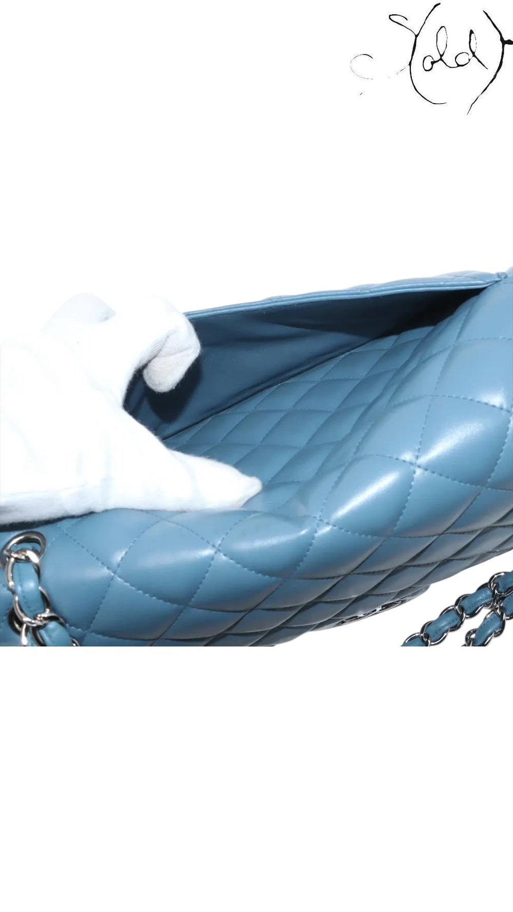 Sold Attire blue lambskin Chanel Deca Matelasse 30 double flap bag with silver hardware and quilted detail.