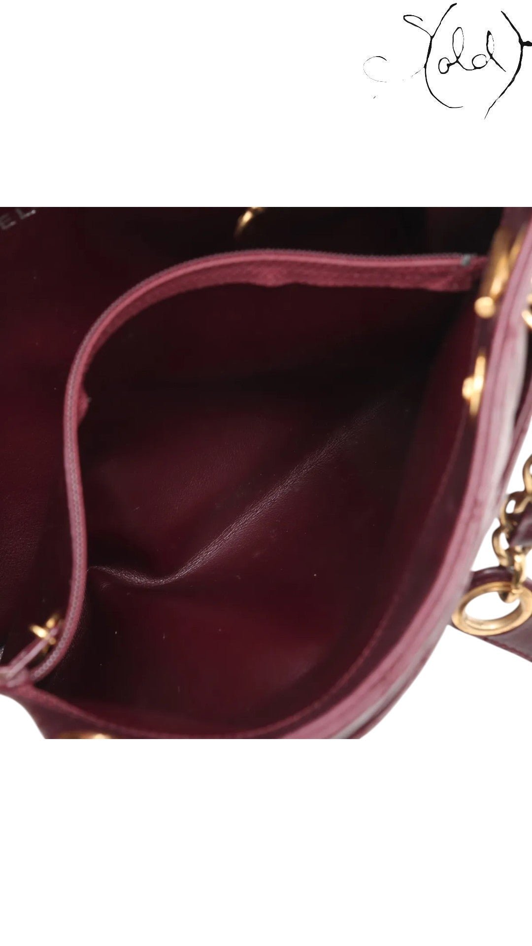 Sold Attire Chanel Matelasse Chain Tote in bordeaux lambskin with gold hardware and Coco Ball charm, circa 1991.