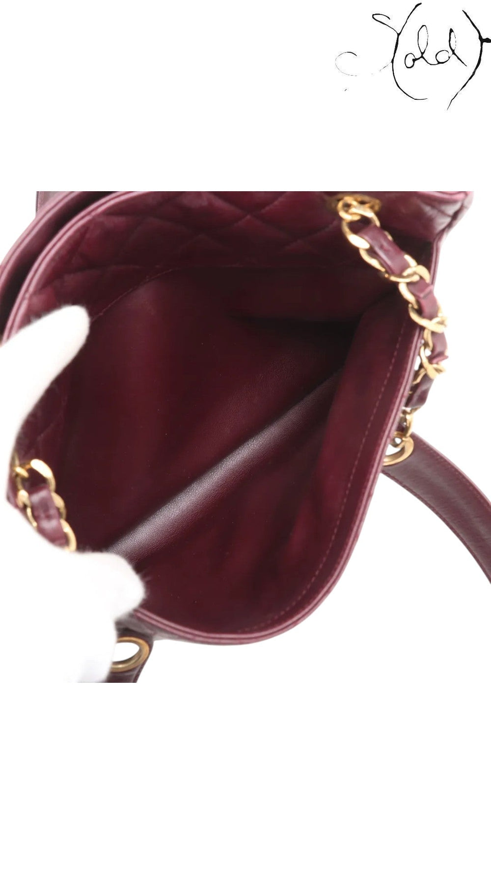 Sold Attire bordeaux lambskin Chanel Matelasse Chain Tote with gold chain and Coco Ball charm, circa 1991.