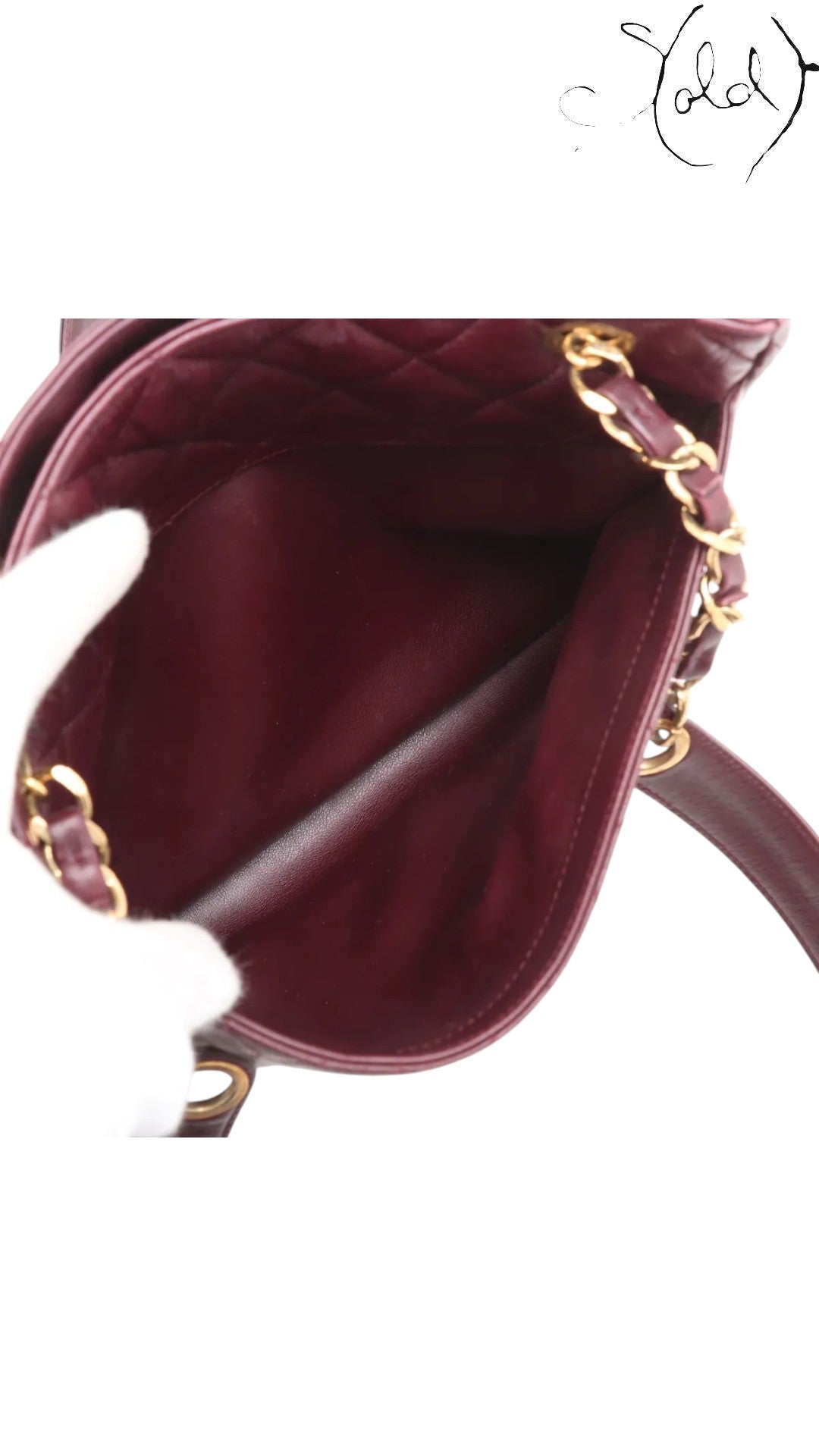 Sold Attire bordeaux lambskin Chanel Matelasse Chain Tote with gold chain and Coco Ball charm, circa 1991.