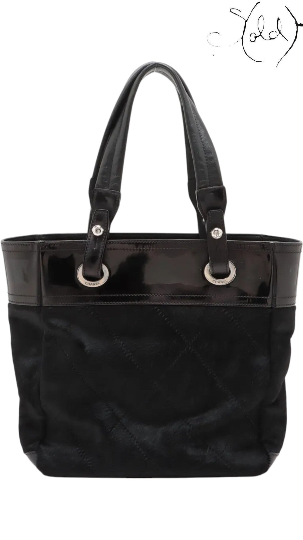 Sold Attire black Chanel Paris-Biarritz PM tote bag with quilted pony hair body and patent leather trim.