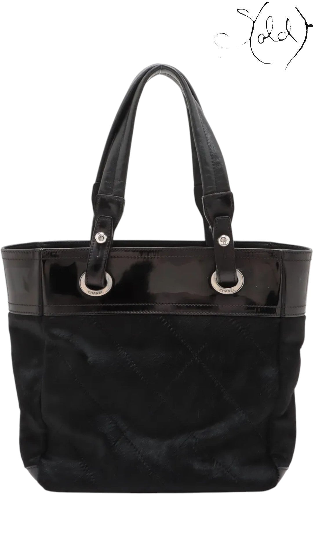 Sold Attire black Chanel Paris-Biarritz PM tote bag with quilted pony hair body and patent leather trim.