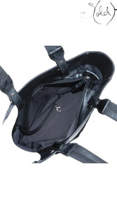 Sold Attire black Chanel Paris-Biarritz PM tote bag made of quilted pony hair and patent leather with silver-tone hardware.