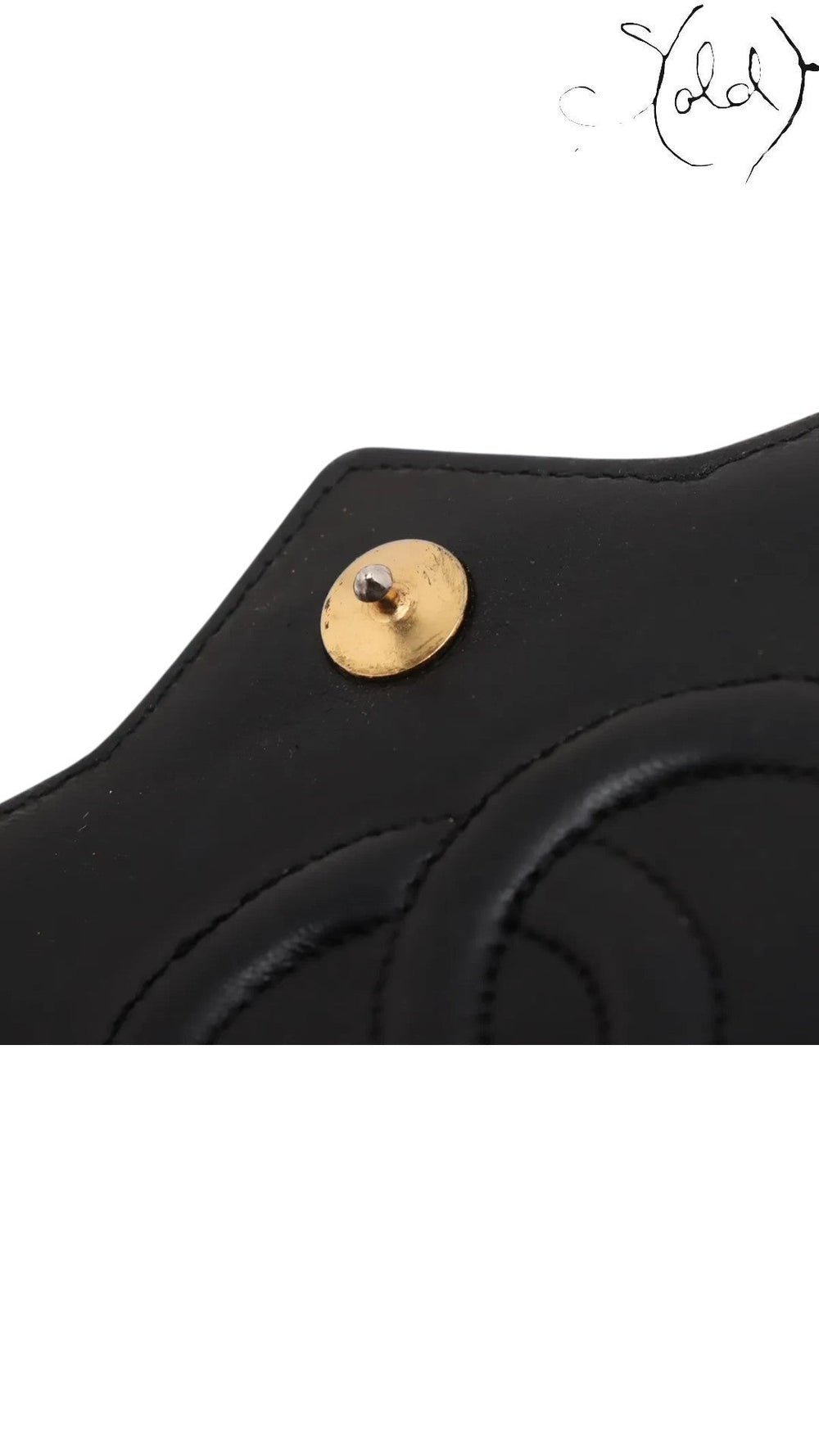 Sold Attire vintage Chanel black lambskin flap bag featuring gold-tone hardware and a crystal CC turn-lock detail.