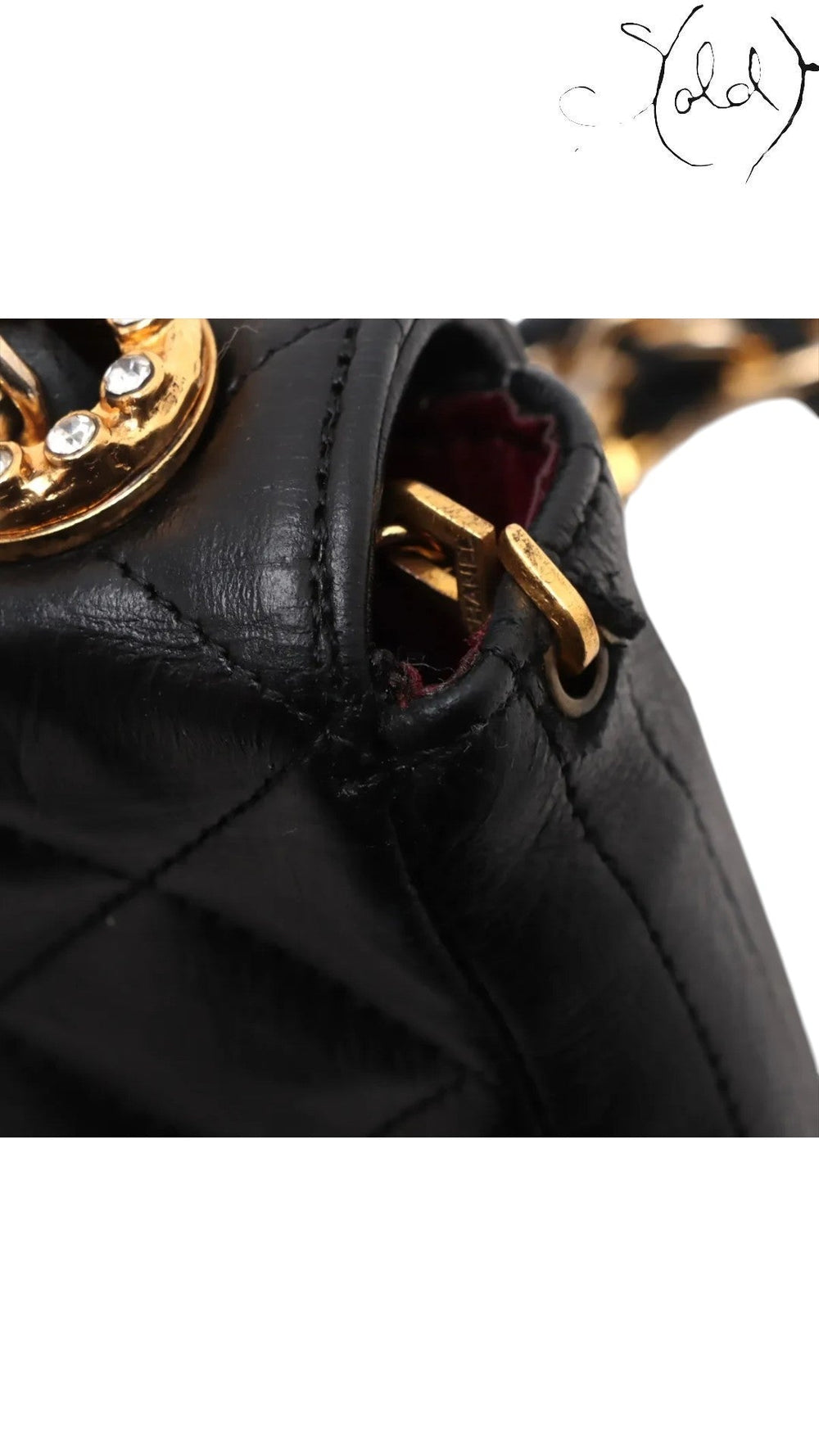 Sold Attire vintage Chanel black quilted lambskin single flap bag featuring a crystal CC turn-lock and gold hardware.