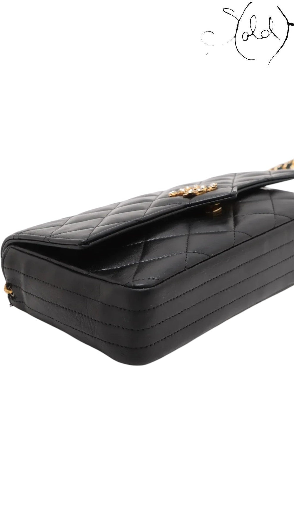Sold Attire vintage Chanel black quilted lambskin single flap bag with crystal CC turn-lock and gold-tone hardware.