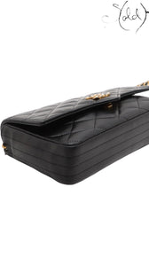 Sold Attire vintage Chanel black quilted lambskin single flap bag with crystal CC turn-lock and gold-tone hardware.