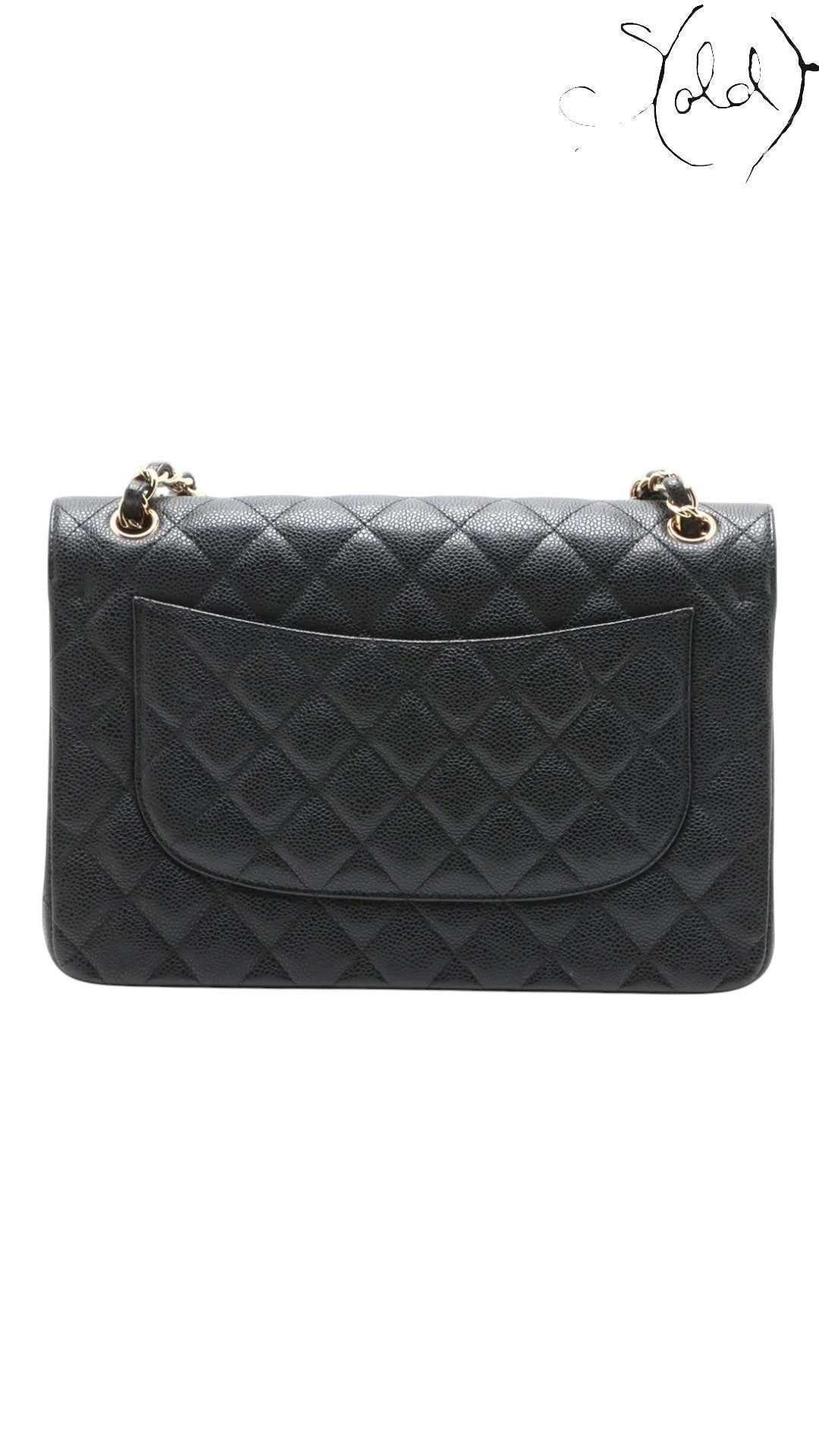 Sold Attire black caviar leather Chanel Jumbo Classic Double Flap bag with gold hardware and quilted diamond pattern.