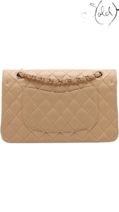 Sold Attire beige lambskin Chanel Medium Classic Double Flap bag with gold hardware and quilted diamond pattern.