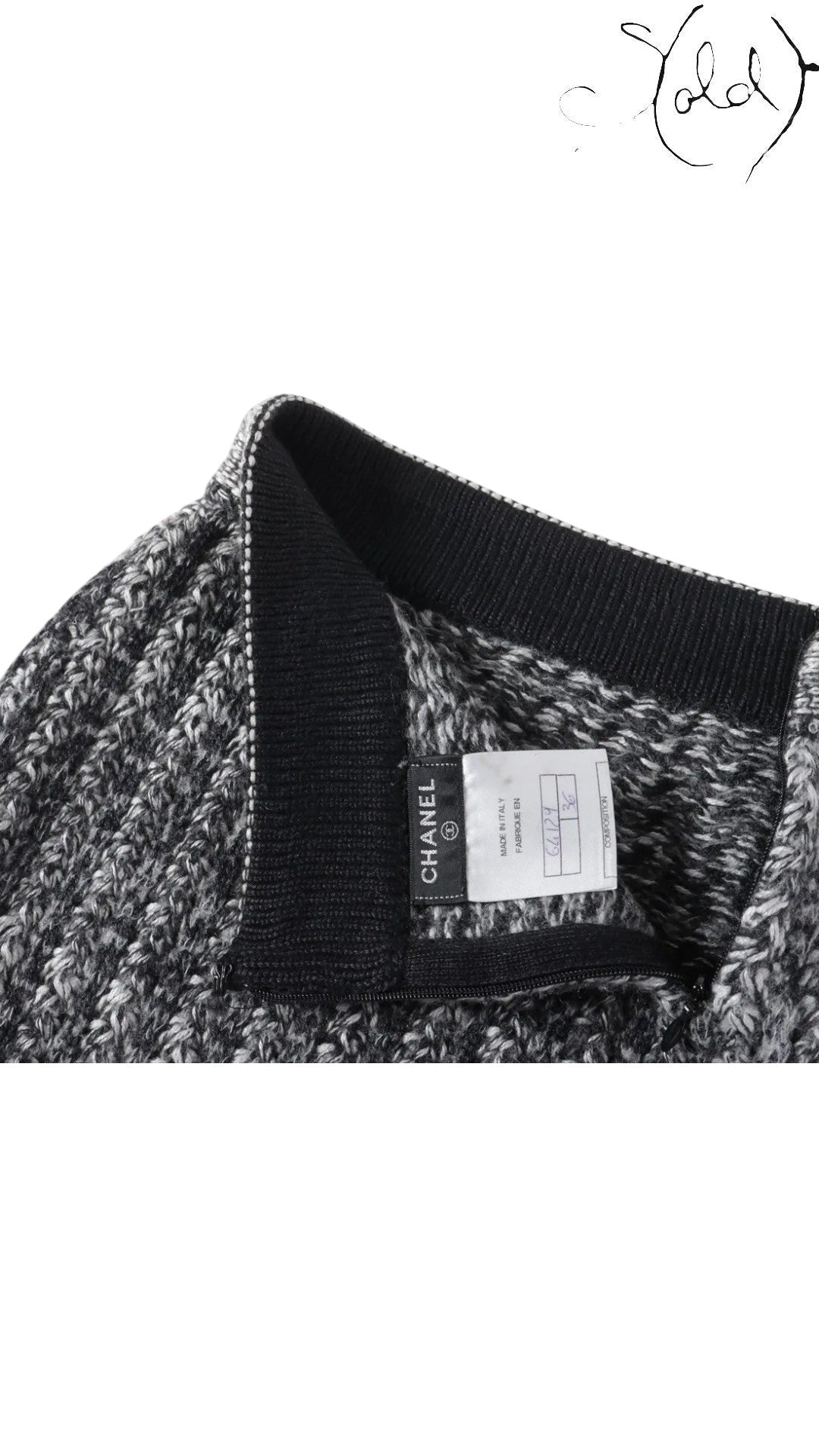 Sold Attire black and grey marled knit Chanel skirt with black ribbed waistband and trim. Features a Chanel logo tag and size 36 label.