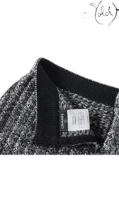 Sold Attire black and grey marled knit Chanel skirt with black ribbed waistband and trim. Features a Chanel logo tag and size 36 label.