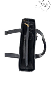 Sold Attire black patent leather tote with gold hardware and interior zip pocket. Early 2000s Karl Lagerfeld design.