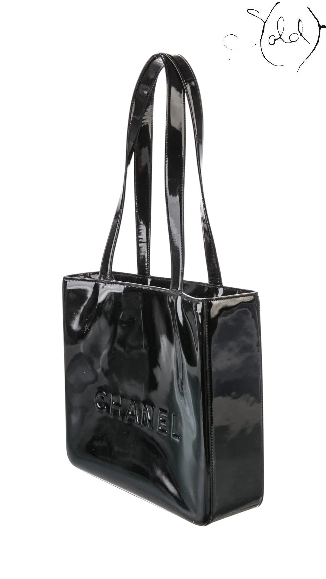 Sold Attire black patent leather Chanel logo tote with gold hardware, early 2000s.