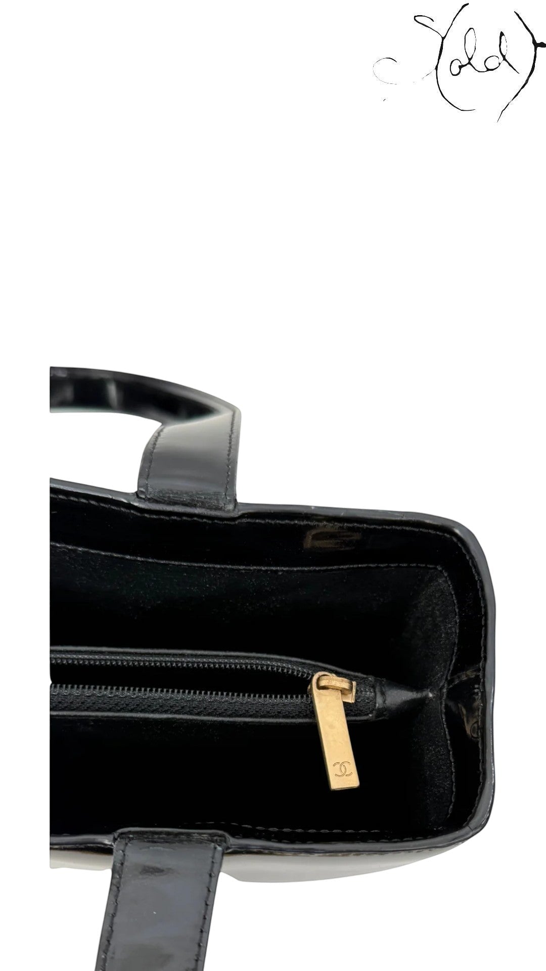 Sold Attire black patent leather tote with gold hardware and CC logo zipper pull, early 2000s.