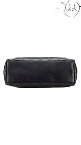 Sold Attire black quilted caviar leather Chanel CC tote with silver-tone hardware.