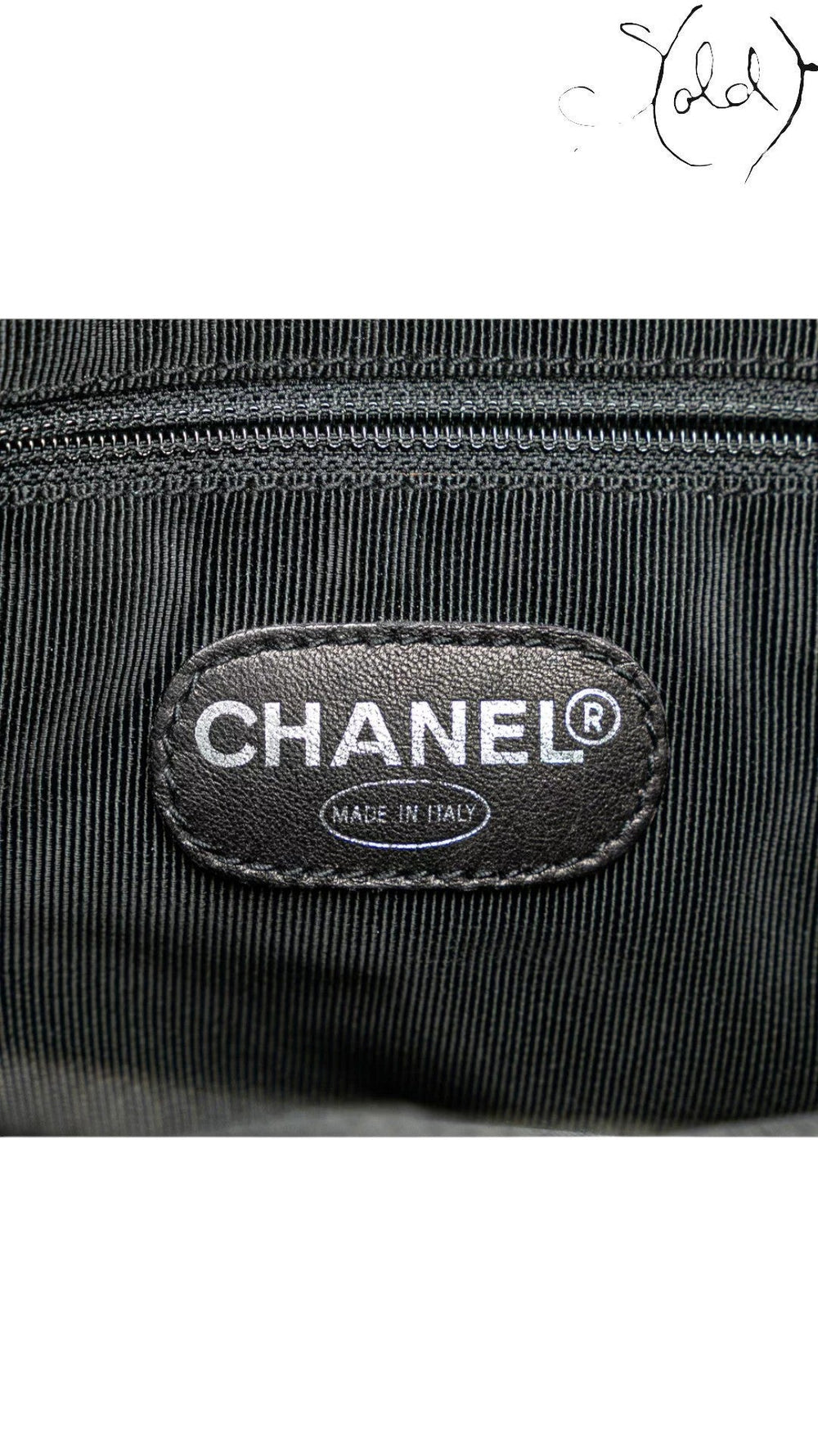 Sold Attire black caviar leather Chanel CC tote with silver-tone hardware and quilted detail.