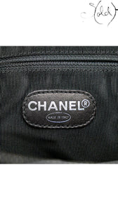 Sold Attire black caviar leather Chanel CC tote with silver-tone hardware and quilted detail.