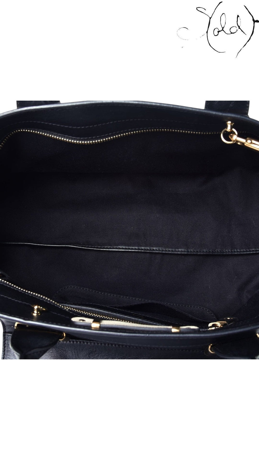 Sold Attire interior view of the black fabric lining and brass-tone zipper pocket of a Chloe Alice large satchel.