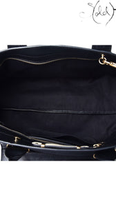 Sold Attire interior view of the black fabric lining and brass-tone zipper pocket of a Chloe Alice large satchel.