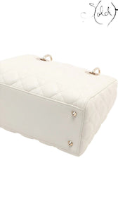 Sold Attire white lambskin Lady Dior medium bag with rose gold hardware and cannage quilting.